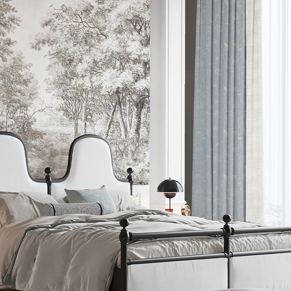 Elegant FLEUR series curtains in soft gray with subtle floral patterns, perfectly complementing a classic bedroom interior with monochrome landscape wall art.