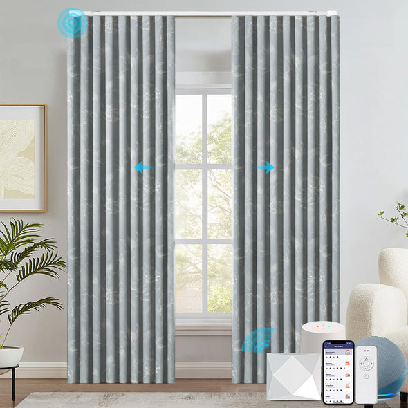 FLEUR smart electric curtains in light gray with subtle floral patterns, shown in a modern room setting. Features motorized opening and closing, compatible with mobile app, voice assistant, and remote control.

