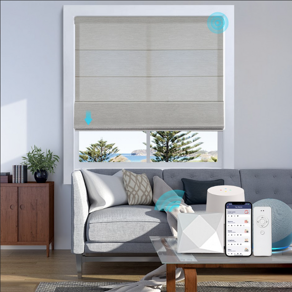 Living room with gray sectional sofa, coffee table, and window with smart roman blinds.