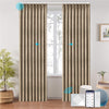LOOM custom motorized blackout curtains in ripplefold style, shown in warm beige with subtle geometric texture. Smart control via app, remote, and voice assistant integration, ideal for modern smart interiors.

