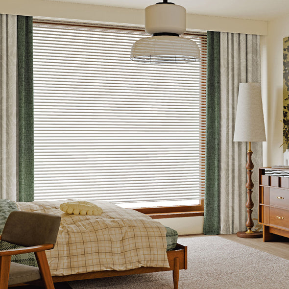 MELLOW series curtains hanging in a bedroom.
