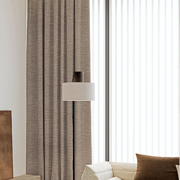 Close-up view of NESTO collection curtain fabric, showcasing textured woven brown material with elegant depth and softness