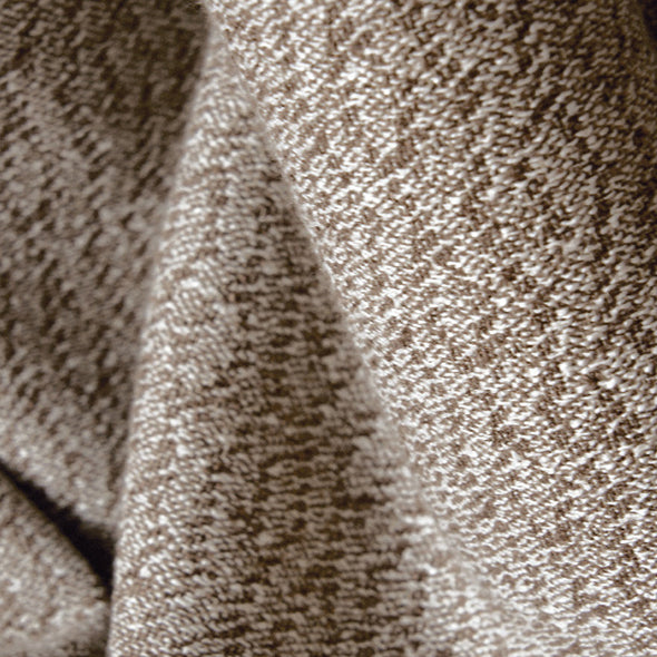 Close-up view of NESTO collection curtain fabric, showcasing textured woven brown material with elegant depth and softness
