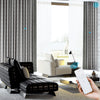 NOVA custom motorized blackout curtains in a modern living room, shown with dual-layer design and remote control operation for easy open-close functionality.