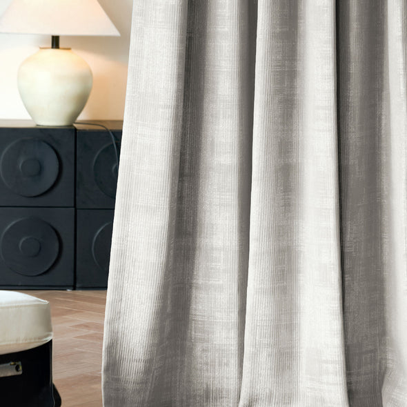 Mid-range close-up of STRONA curtain fabric highlighting subtle crosshatched texture and layered weave, providing a refined matte finish for high-end interiors.