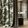Close-up of VERDANA series electric curtain fabric, featuring green tropical botanical prints paired with deep gray blackout lining, highlighting the texture and pattern for premium smart home interiors.