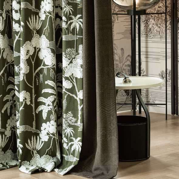 Close-up of VERDANA series electric curtain fabric, featuring green tropical botanical prints paired with deep gray blackout lining, highlighting the texture and pattern for premium smart home interiors.
