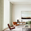 ZENIA series motorized curtains with textured geometric pattern in a modern natural-toned living space.